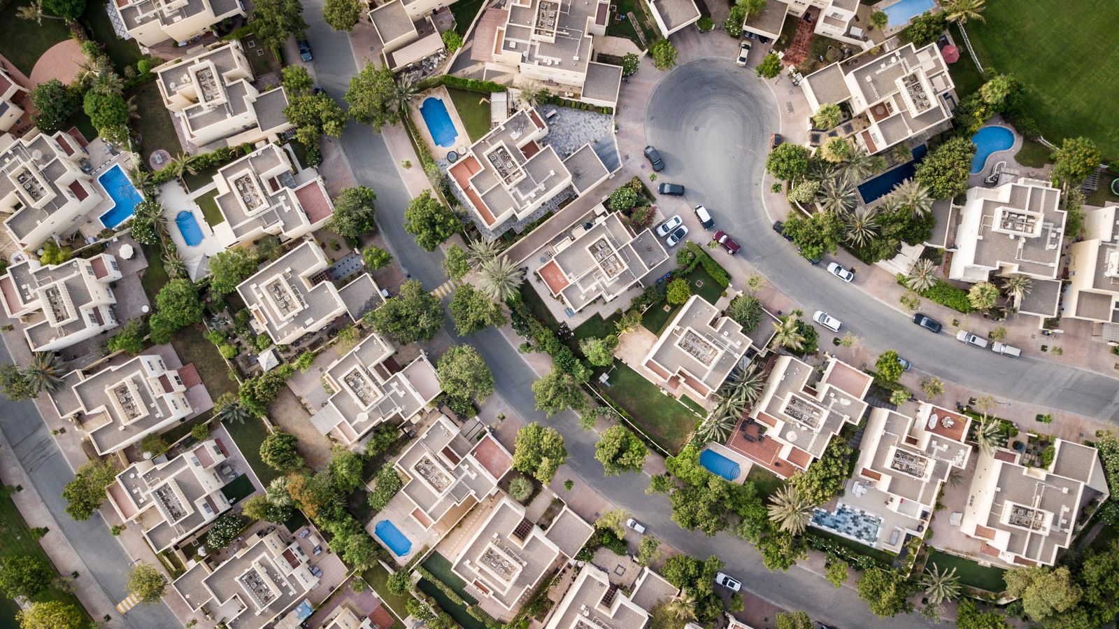 Aerial view of a residential complex with pools and tropical vegetation in the Dominican Republic